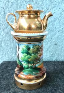 Porcelain teapot warmer with gold decoration and landscapes with figures and architecture. France, Empire period.