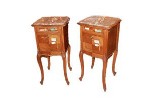 Pair of Louis Philippe style walnut bedside tables from the 1800s with marble and carvings.