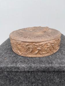 Terracotta box with mythological scene and trophies. Signa, Tuscany.