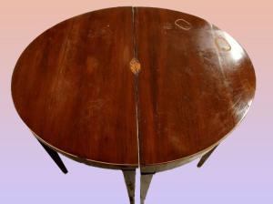Pair of English Smith-style half-moon consoles with central inlay.