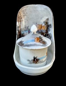 Porcelain trembleuse bedside cup with stand.
