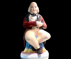 Bisque porcelain snuff box with seated male figure. France.
