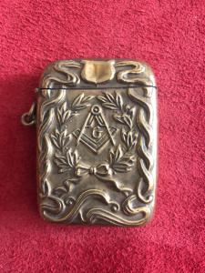 Brass matchbox with Masonic symbols.