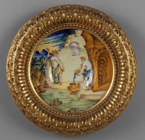 Polychrome ceramic plate, carved and gilded wooden frame, Venice 16th century