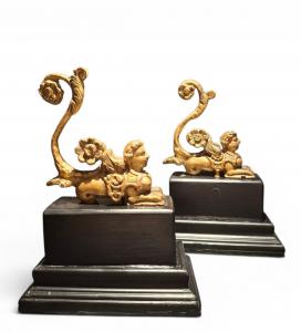 Pair of gilded wooden sphinxes
