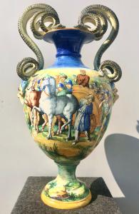 Large majolica vase with serpentine handles and historical decoration of the Triumph of David over the Assyrians. Signed S.C.A. Pesaro.