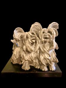 Sculpture depicting a terracotta dog couple with a wooden base. Cacciapuoti manufacture, Milan.