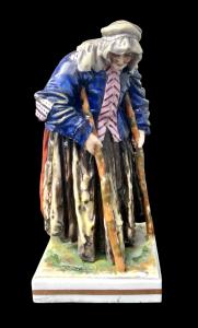 Figura en porcelana de mujer mendiga. Manufactura Ginori-Capodimonte.