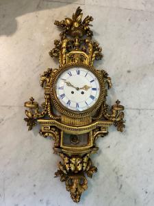 Orologio in legno dorato 