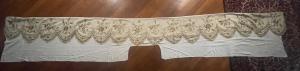 Sacred vestment with floral decorations embroidered in gold thread.