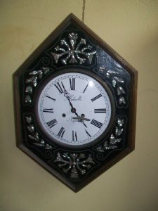 Bull's-eye pendulum clock with mother-of-pearl inlays, 20th century.