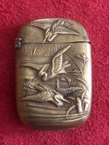 Brass matchbox with herons.