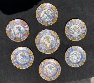 Seven majolica plates decorated with luster in the third firing with warrior profiles and stylized plant motifs. Gualdo Tadino.