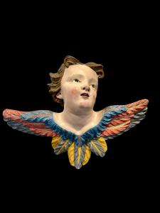 Angel-cherub in carved and painted wood. Liguria.