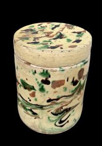 Slip-decorated ceramic box with a marbled effect.
