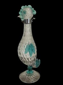 Bottiglia in vetro  balloton  acquamarina leggermente iridato.Flavio Poli per Seguso vetri d’arte.Murano.