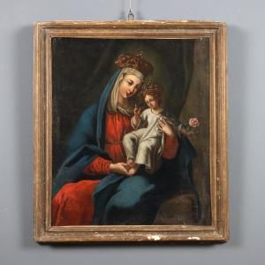 Oil painting of the Madonna and Child, both crowned.