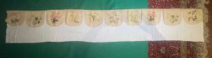 Sacred vestment with painted floral decoration.