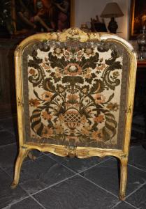 Venice, 18th Century, lacquered and gilded wooden fire screen with fabric embroidered with floral motifs in the center.