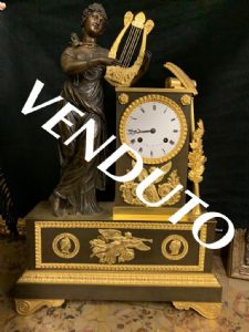 Charles X blackened and gilded bronze clock