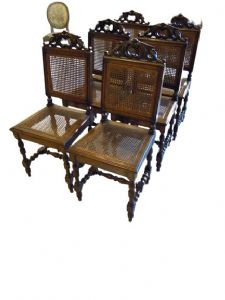 Six cane-seated chairs