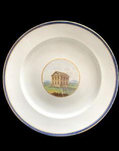 Porcelain plate with central medallion depicting ruins. Inscription on the back. Ginori Doccia manufactory.