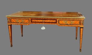 Louis XVI style desk veneered in rosewood, ebony, and exotic woods, France late 19th century