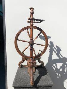 Walnut wood spinning wheel.