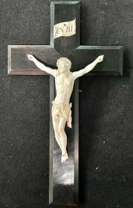 Ivory Christ on an ebony wood cross.