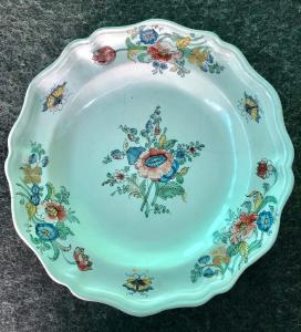 Majolica plate with floral decoration and gold highlights. Royal factory of San Carlo, Caserta.