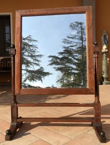 Large walnut wood psyche mirror, with shaped base, columns and capitals, from the 1800s.