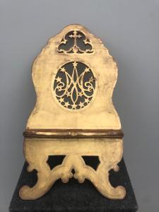 Folding wooden lectern with gold leaf, 'Marian' motif, and pierced cross.