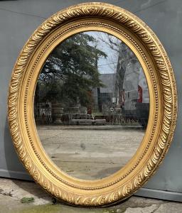 Large golden oval mirror