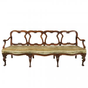Four-seater carved walnut sofa. Venice, mid-18th century.