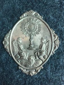Brass cloak clasp depicting two angels with a monstrance. Confraternity of the Angels and the Blessed Sacrament. Genoa.