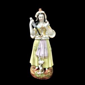 Porcelain night light teapot depicting a female spinner. France. Louis Philippe period.