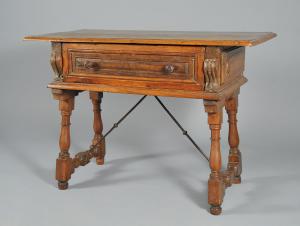 Spool-leg table with one drawer and legs connected by iron elements, 17th century.