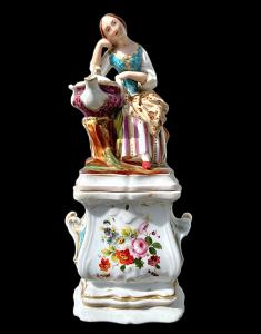Figurative porcelain veilleuse with lady and floral decoration. France