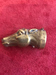 Brass match holder depicting a horse's head.