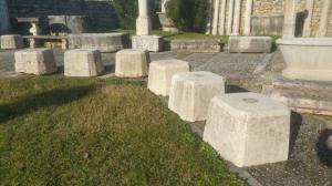 Sixteen antique bush-hammered marble bases