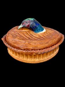 Oval porcelain tureen with a pheasant head handle.