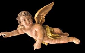 Polychrome carved wooden sculpture depicting an angel with spread wings. Liguria.