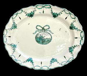 Majolica plate with plant motifs, festoons and landscape decoration. Giacomo Boselli signature. Savona.