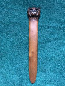 Boxwood letter opener in one piece depicting the head of a Molossian dog.