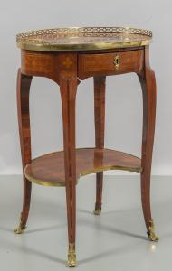 An oval centre table, veneered and inlaid, France, second half of the 18th century.