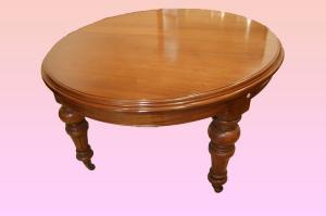 Grande mesa circular extensível antiga inglesa de mogno do século XIX, já restaurada e com extensões.