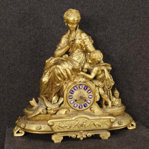 French clock in golden antimony 