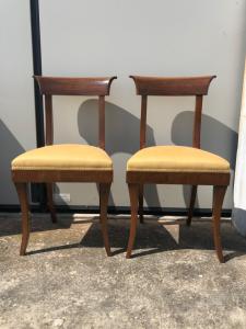 Four chairs in light walnut, Directoire period.
