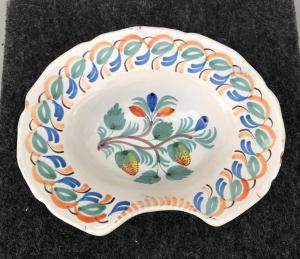 Oval shaving dish decorated with fruit. France.