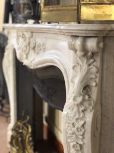 Large French Carrara white marble fireplace with reducer.